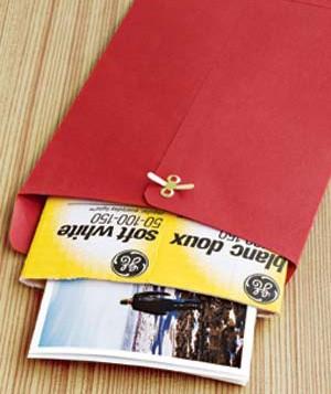 Use a light bulb carton to protect photos when sending them through the mail