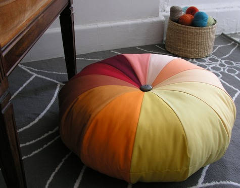 A color wheel pinwheel pouf